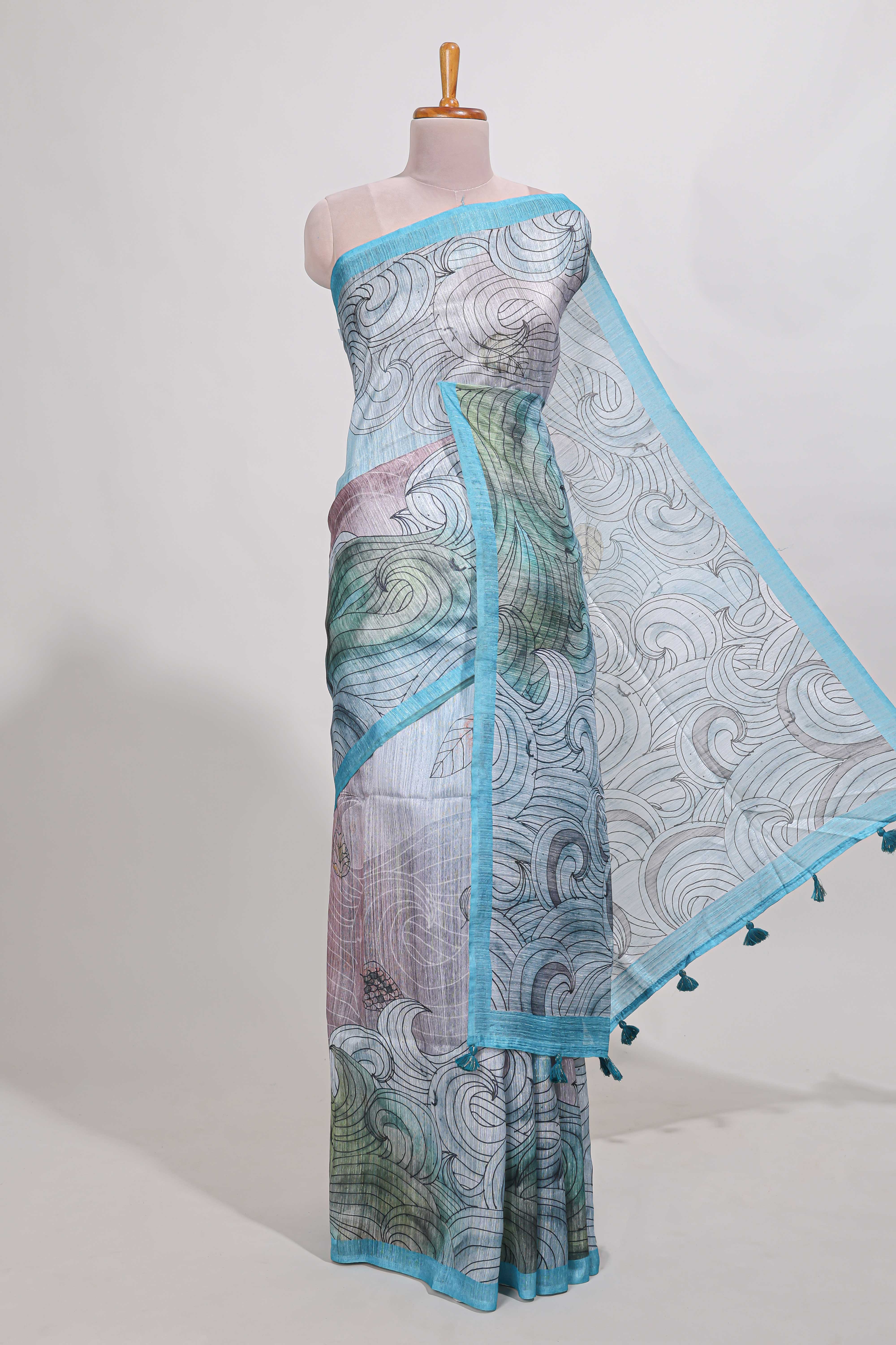 Blue colour printed semi tussar saree with pipping border and leaf printed matching blouse - Image 2