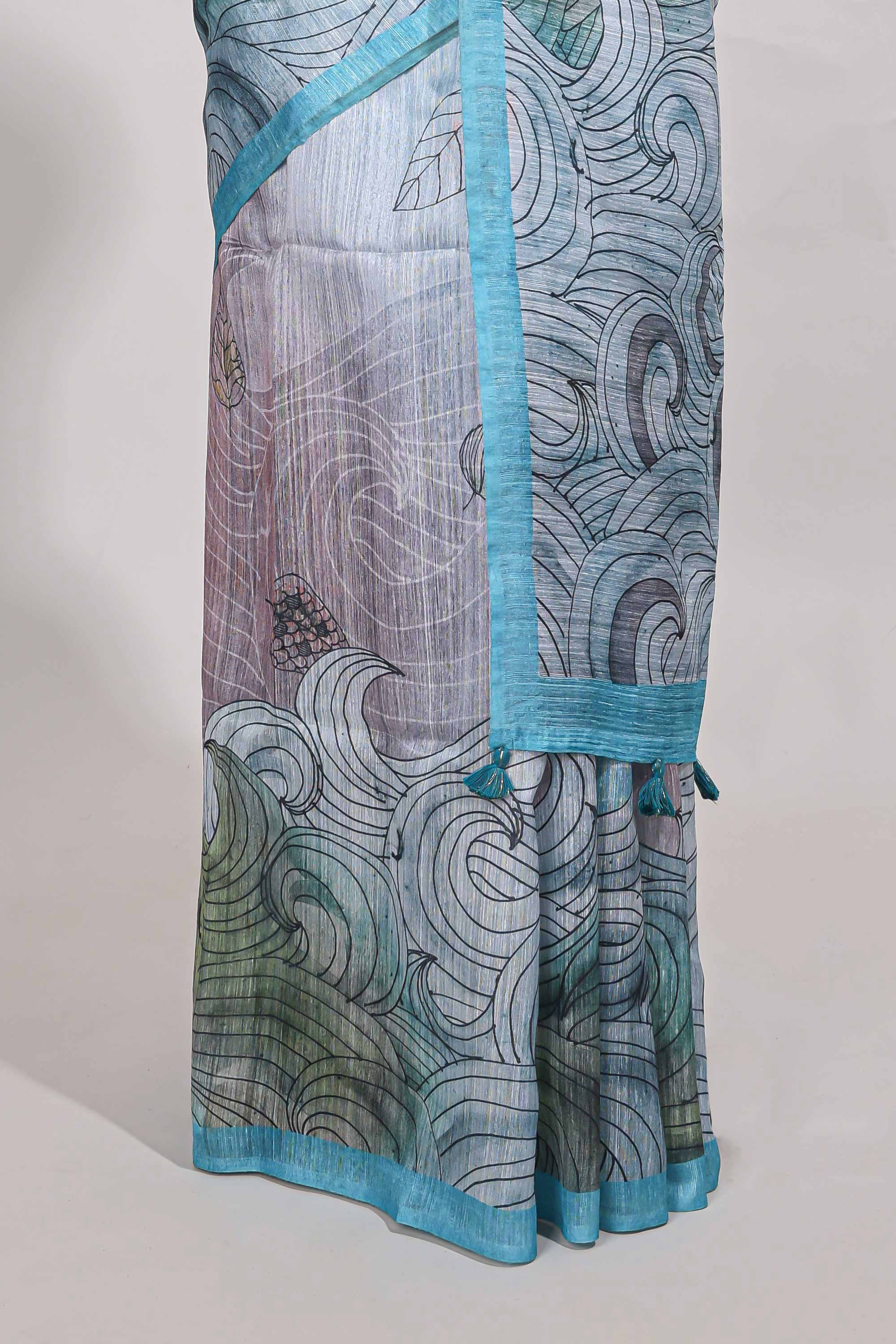 Blue colour printed semi tussar saree with pipping border and leaf printed matching blouse - Image 4