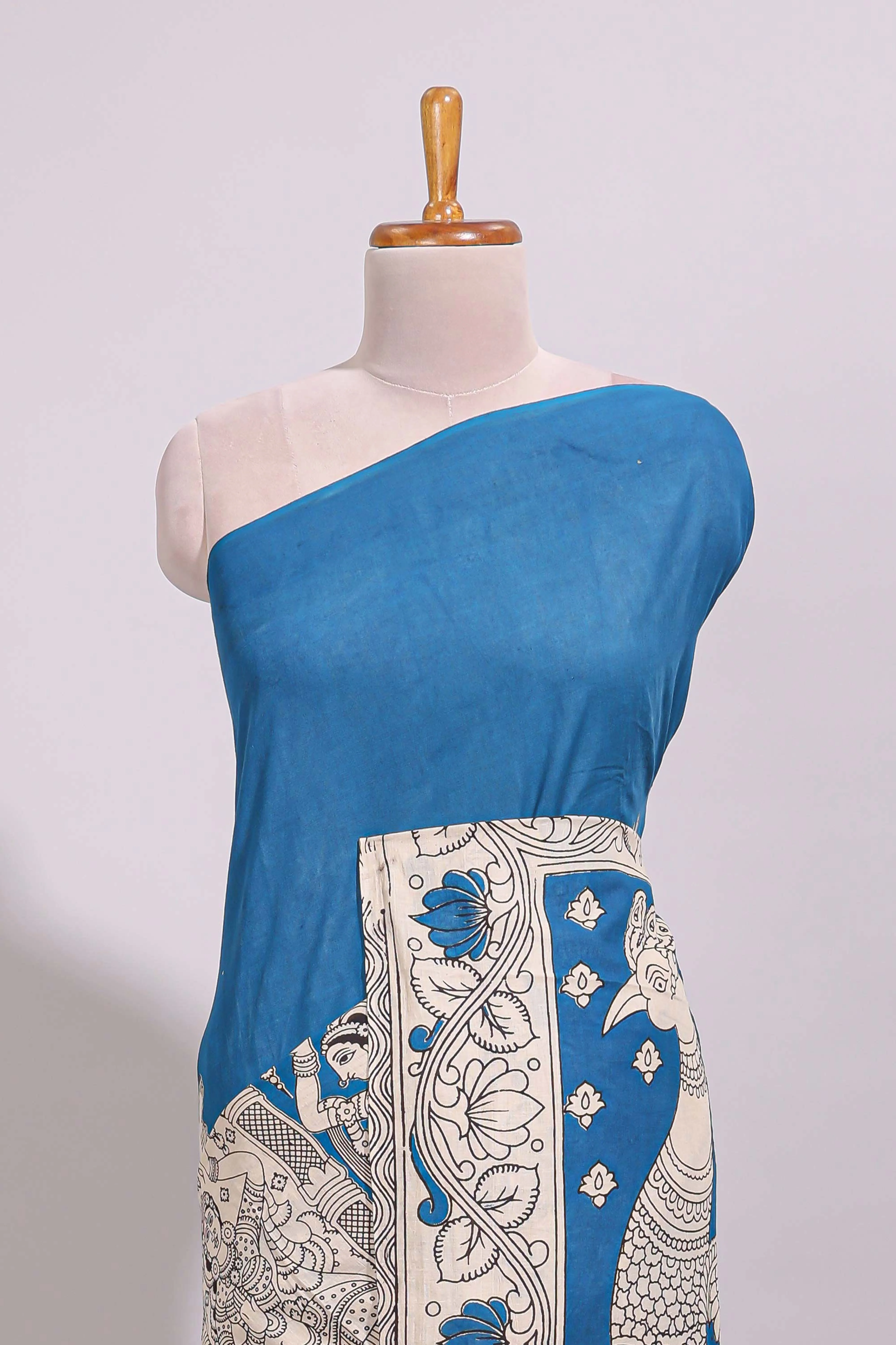 Blue hand painted peacock & floral design kalamkari cotton saree with contrast border and floral printed blouse - Image 3