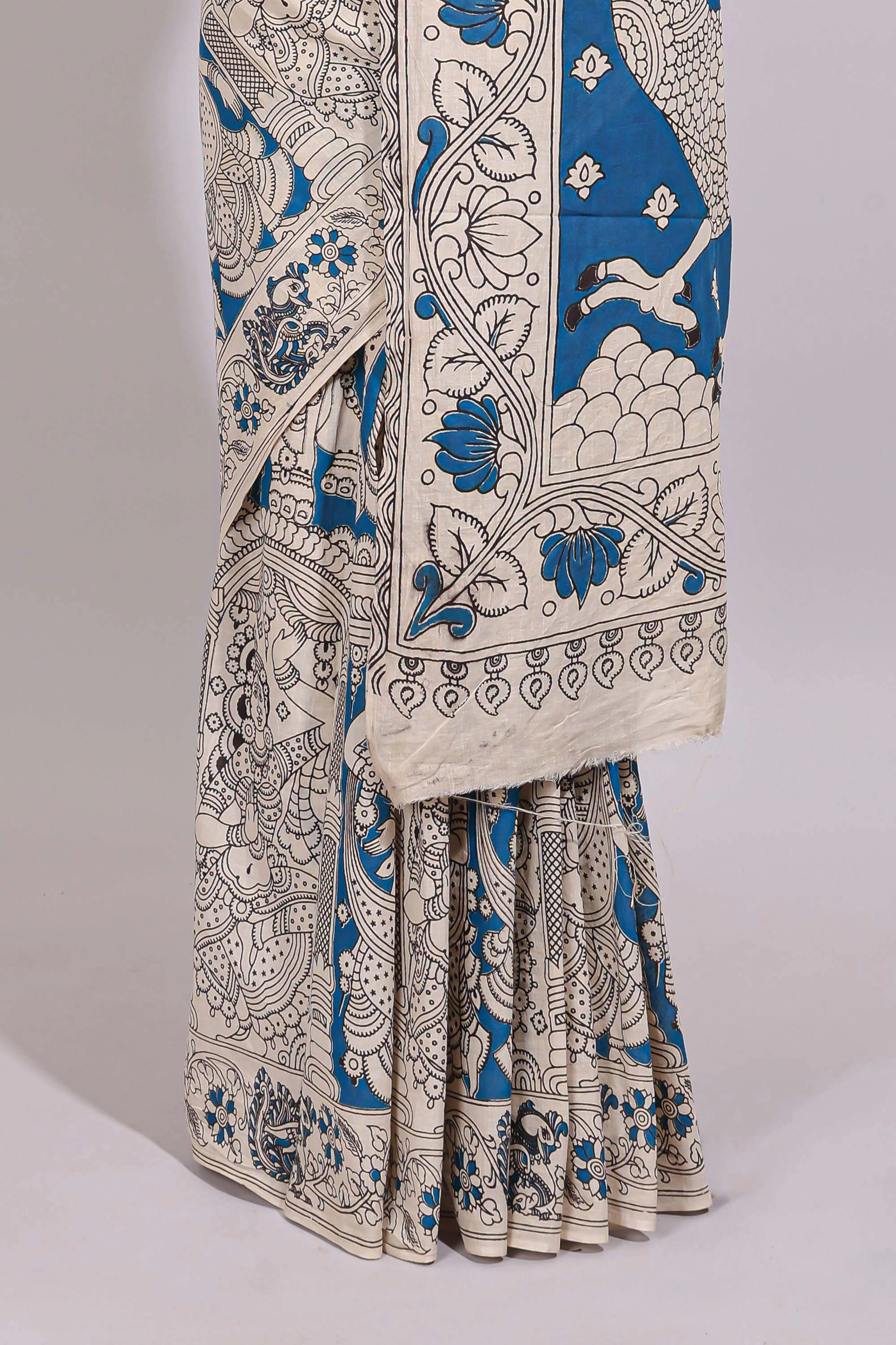 Blue hand painted peacock & floral design kalamkari cotton saree with contrast border and floral printed blouse - Image 4