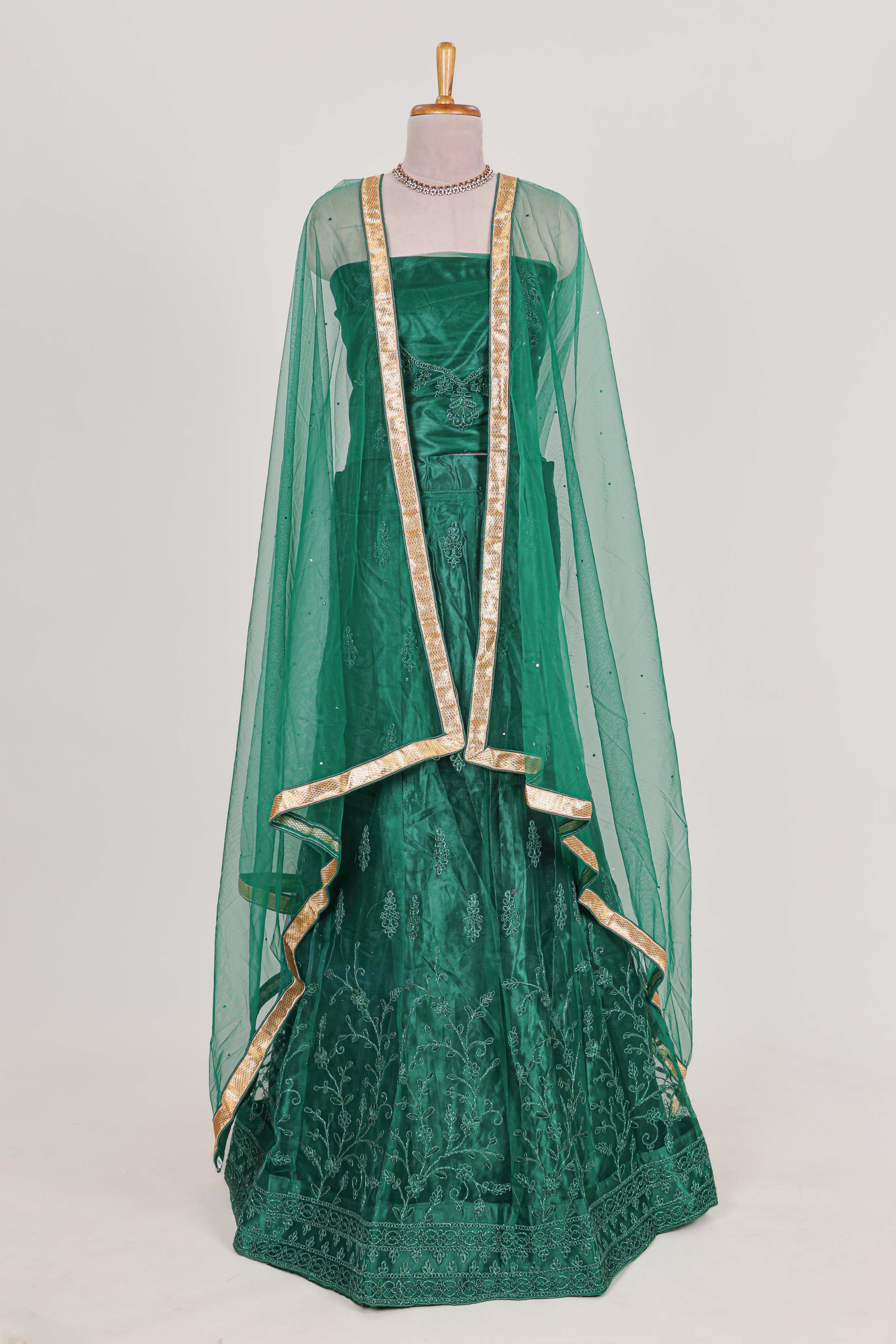 Bottle Green net lehenga featuring delicate embroidery with a borderless design paired with a matching self shawl - Image 3