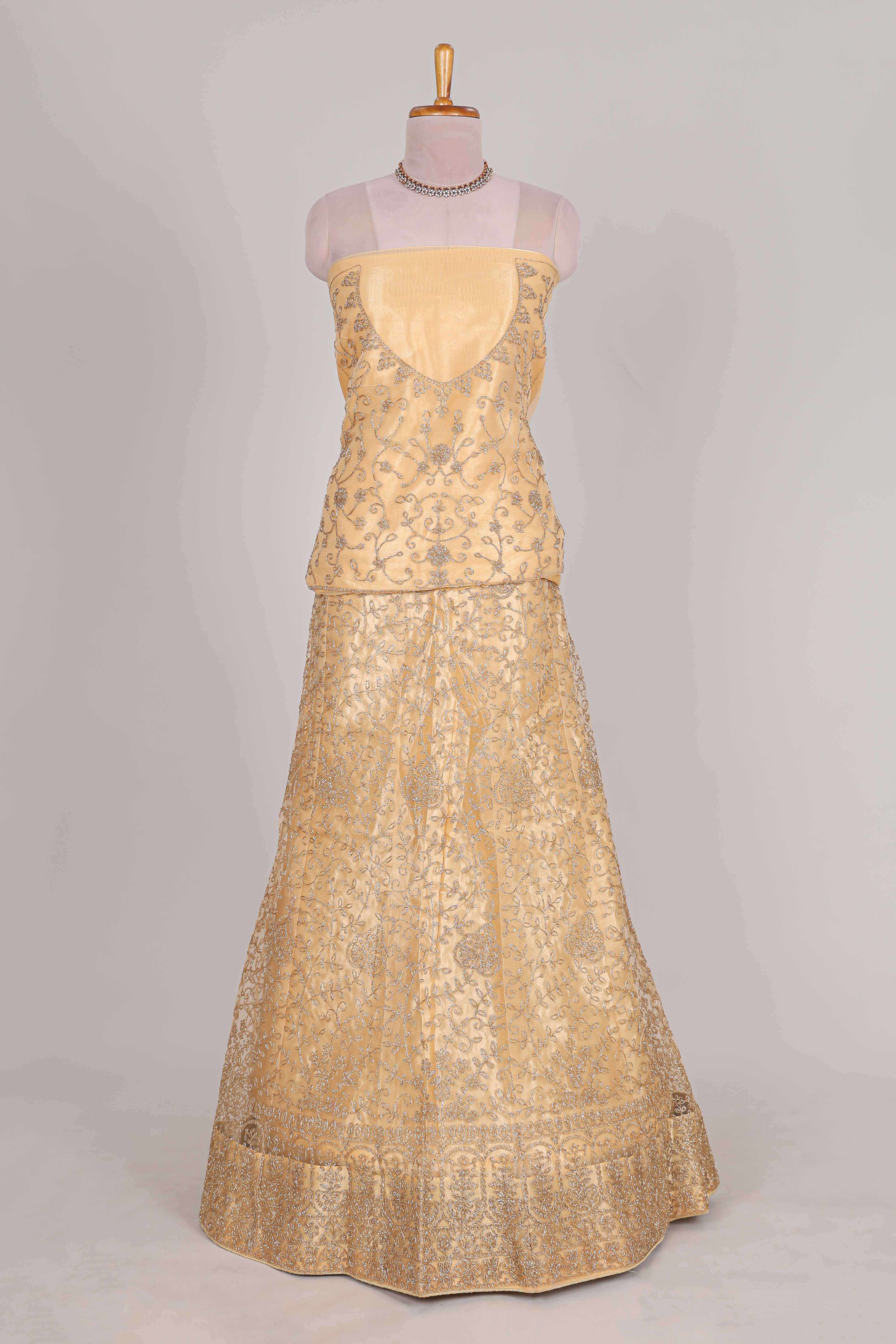 Cream colour net lehenga featuring delicate embroidery with a borderless design paired with a matching self shawl - Image 2