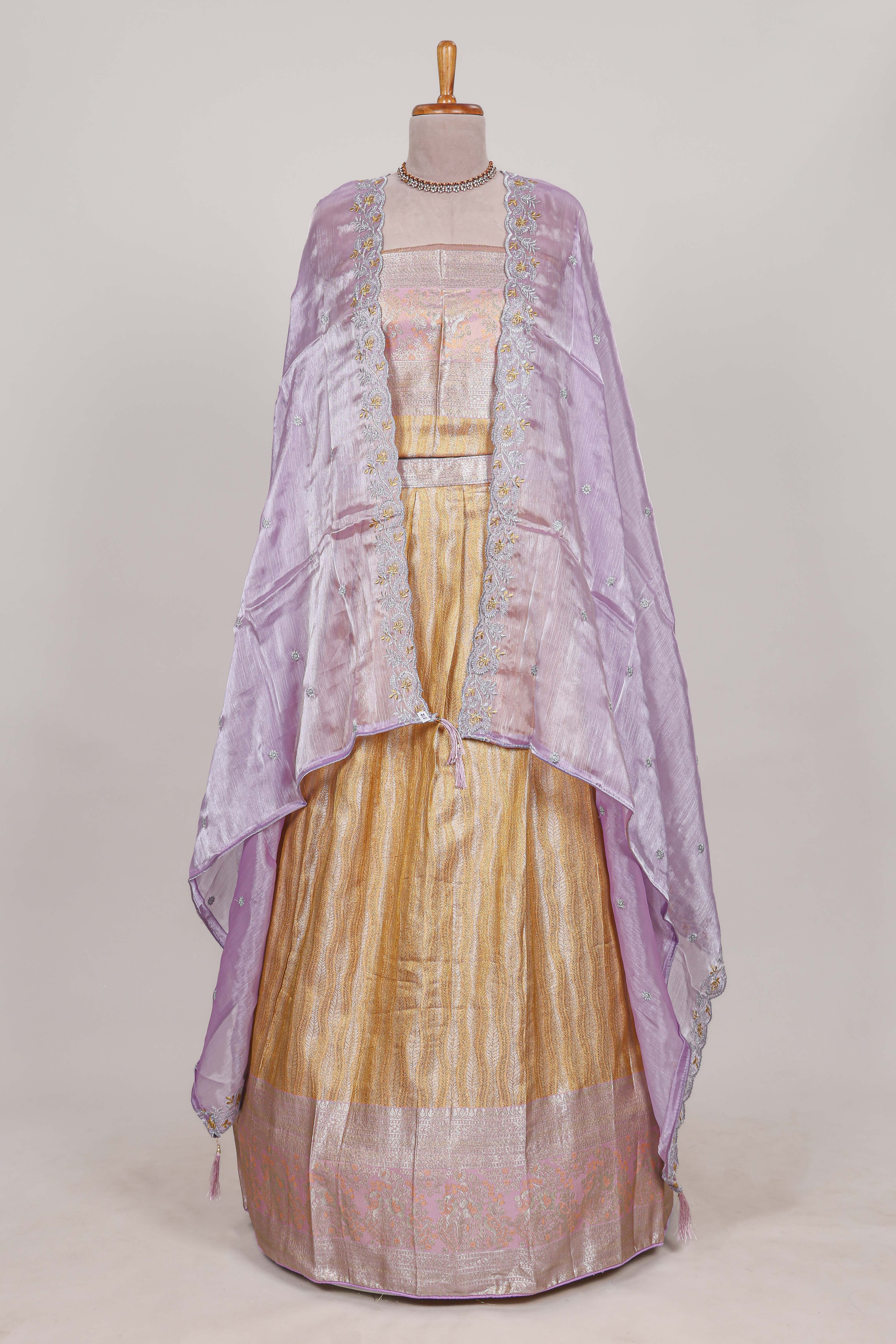 Cream tissue lehenga featuring elegant vertical line patterns with a beautiful contrast border Paired with a matching shawl - Image 3