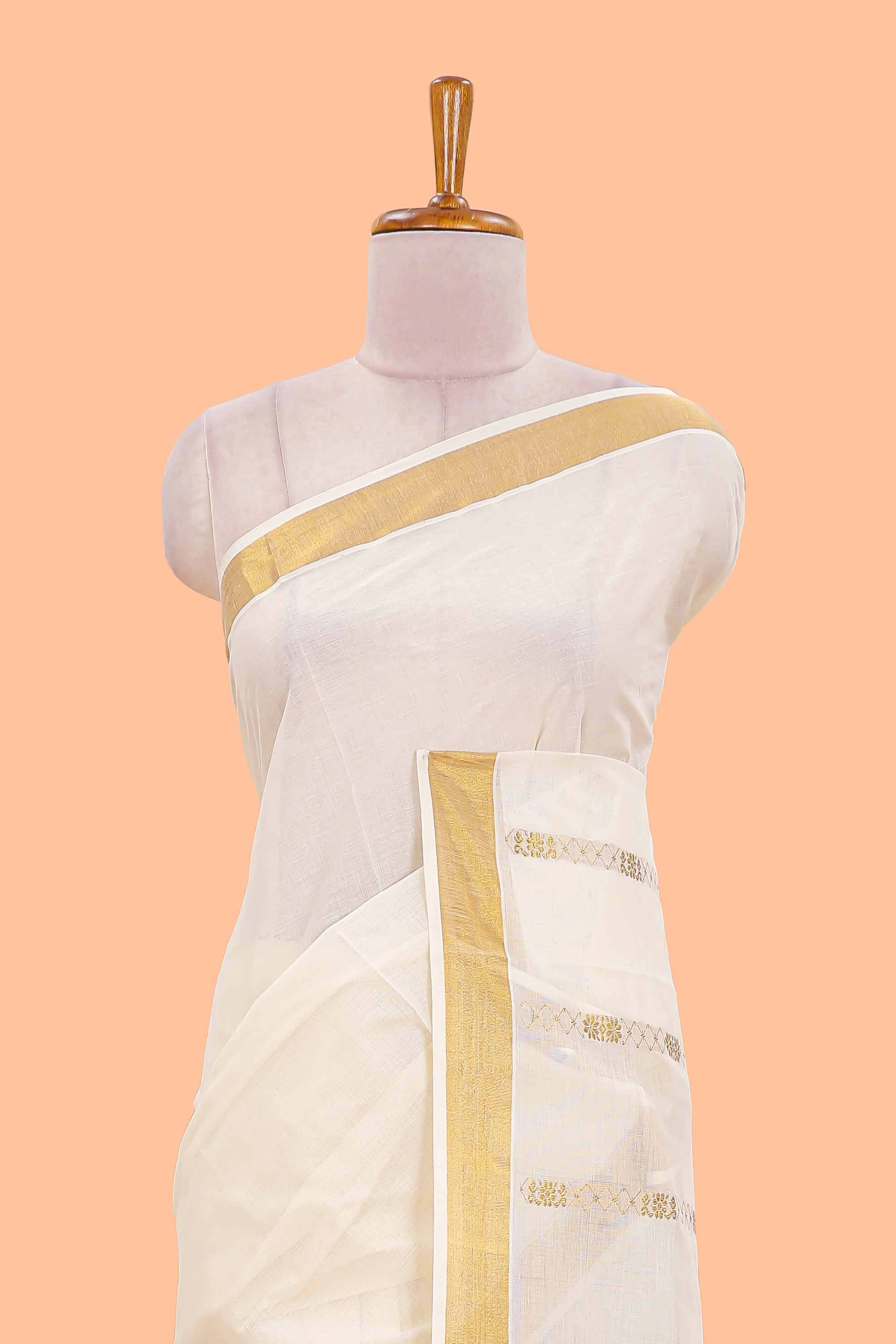 Cream kerala cotton saree with rich peacock design pallu and gold jari lines - Image 3