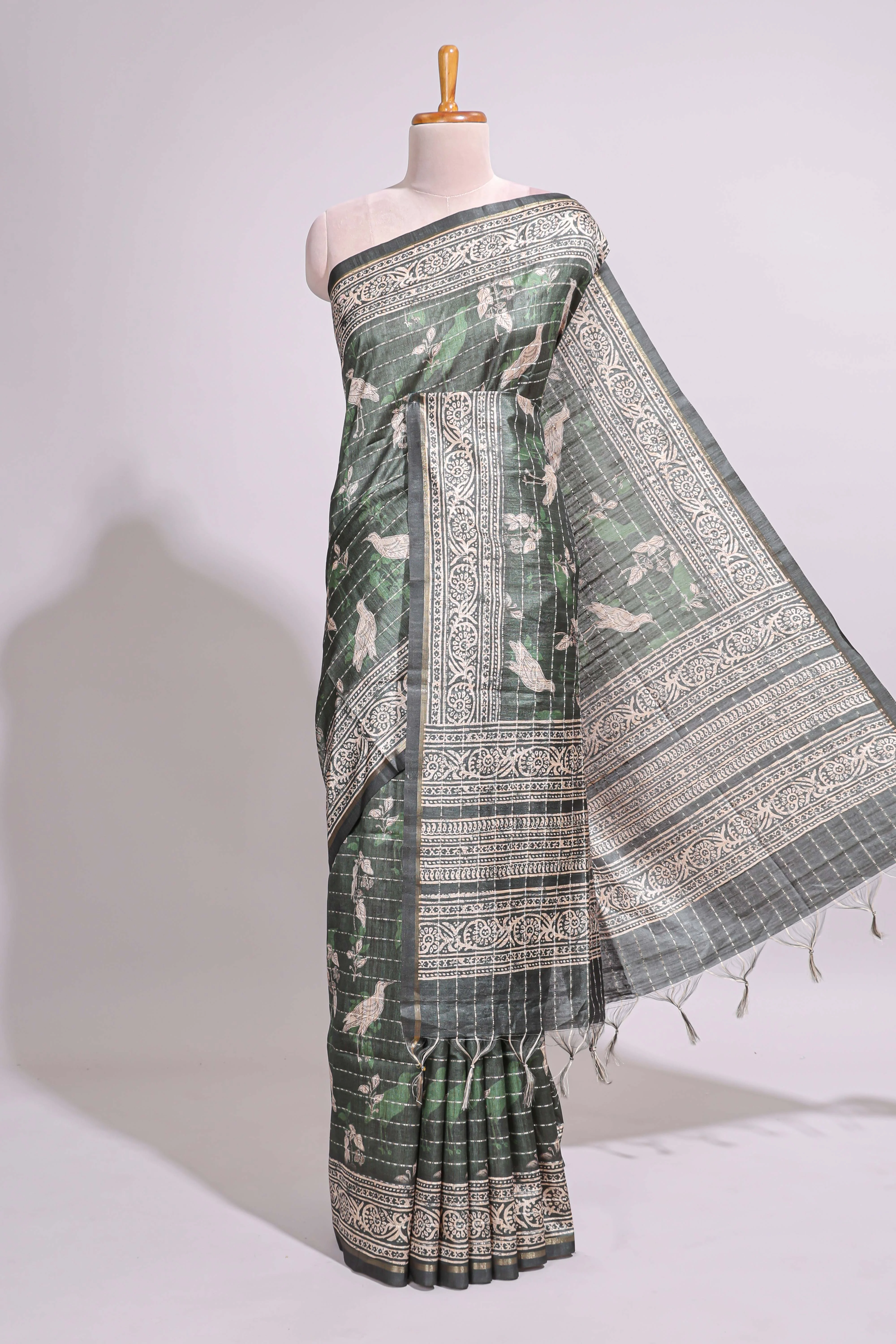 Forest green birds and floral design art tusser saree with contrast border and floral motifs blouse