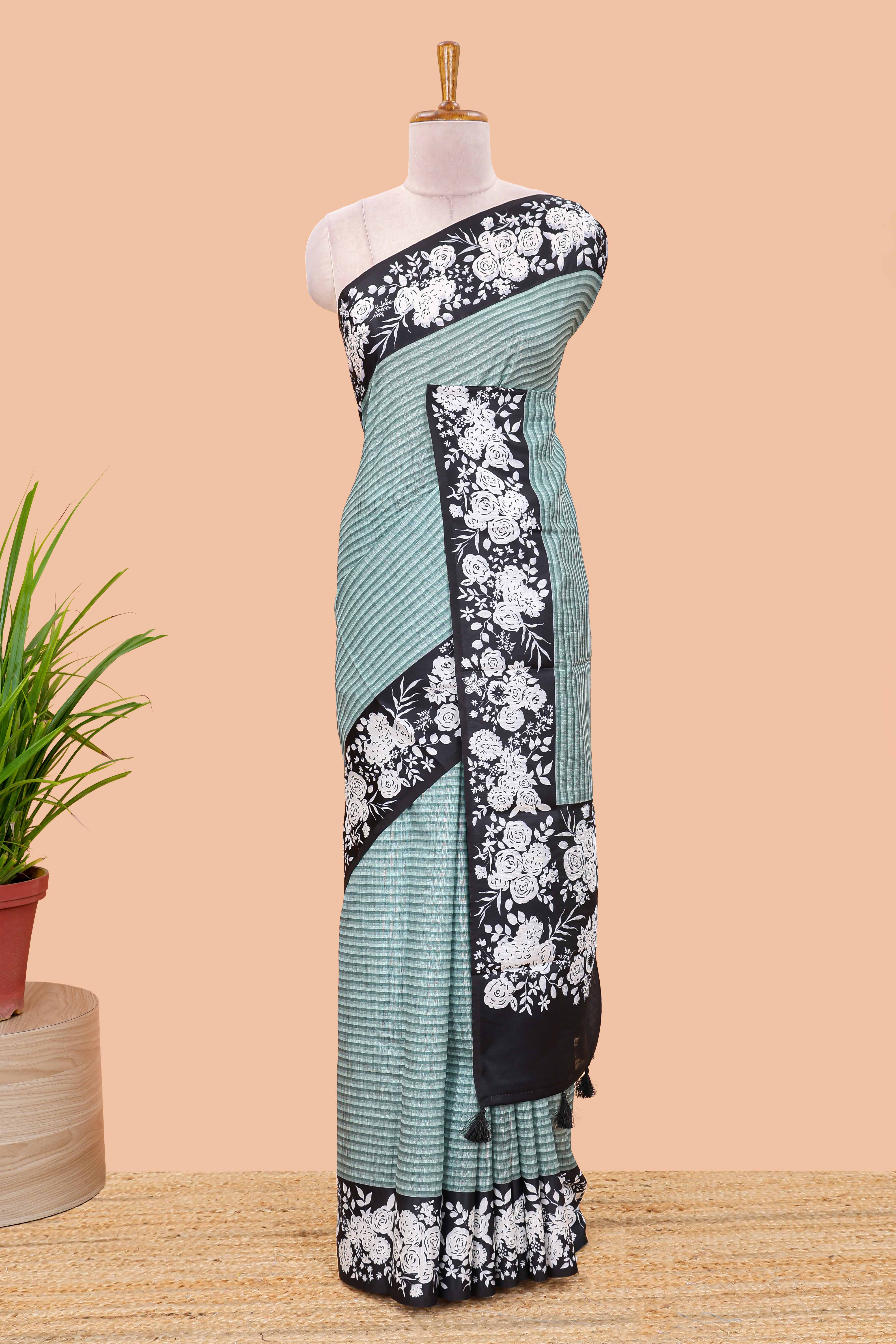 Green linen cotton saree with all-over stripe print and black satin border with floral print pallu - Image 2