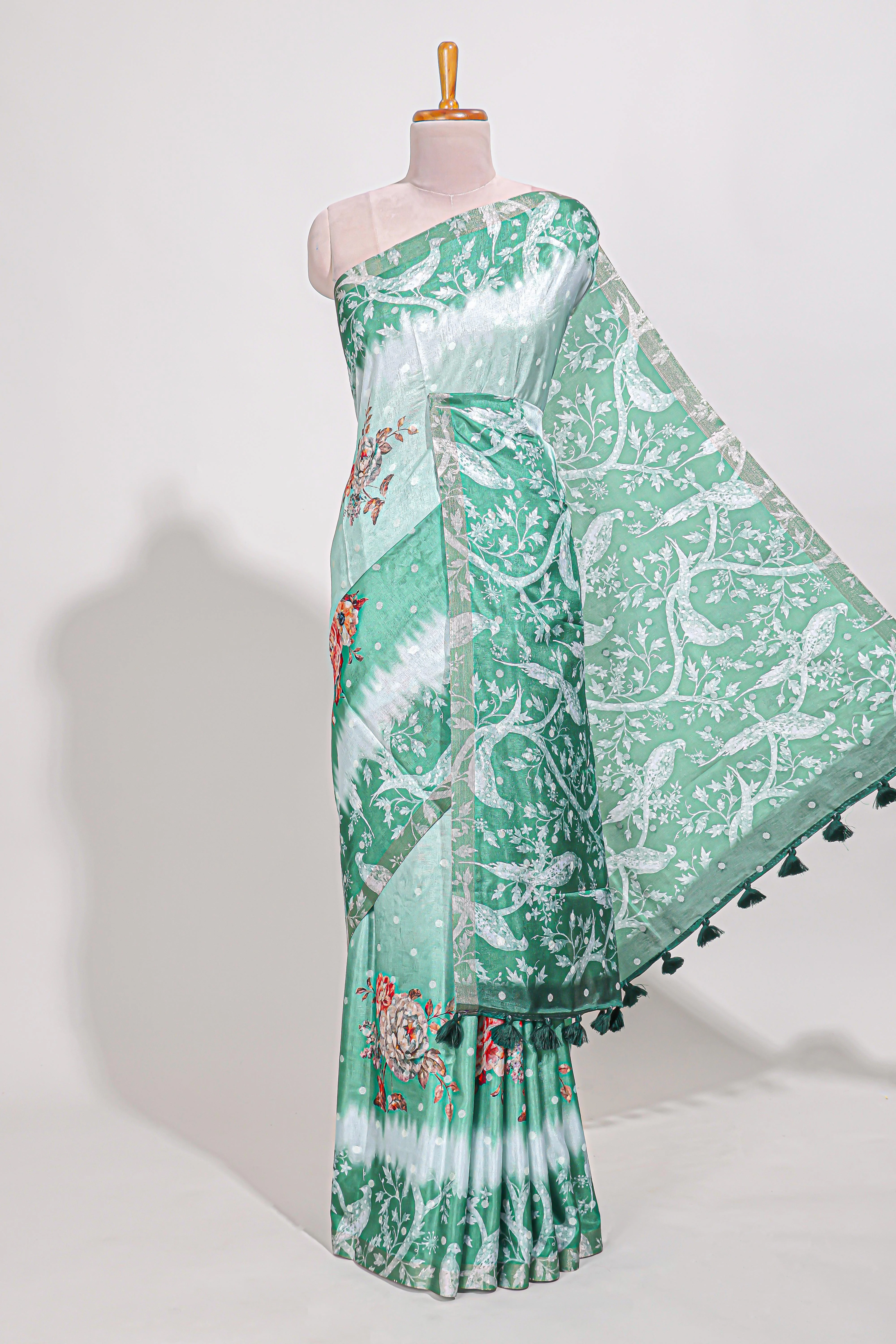 Green Tussar saree with a floral body featuring bird motifs a printed pallu with tassels and a matching floral blouse piece - Image 2