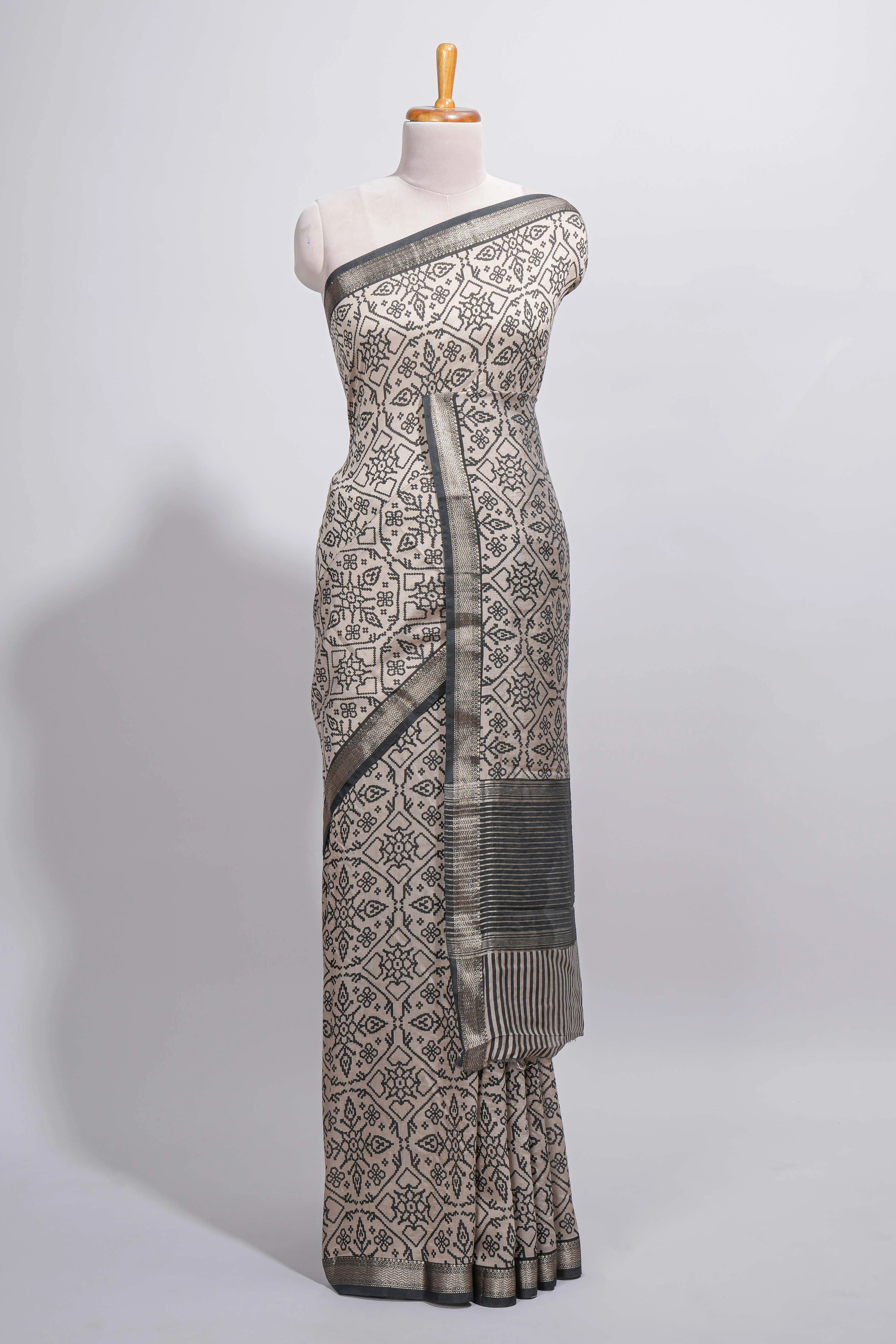 Ivory colour Assam Silk saree traditional folk motif print floral patterns and a contrast woven border The detailed pallu along with contrast blouse