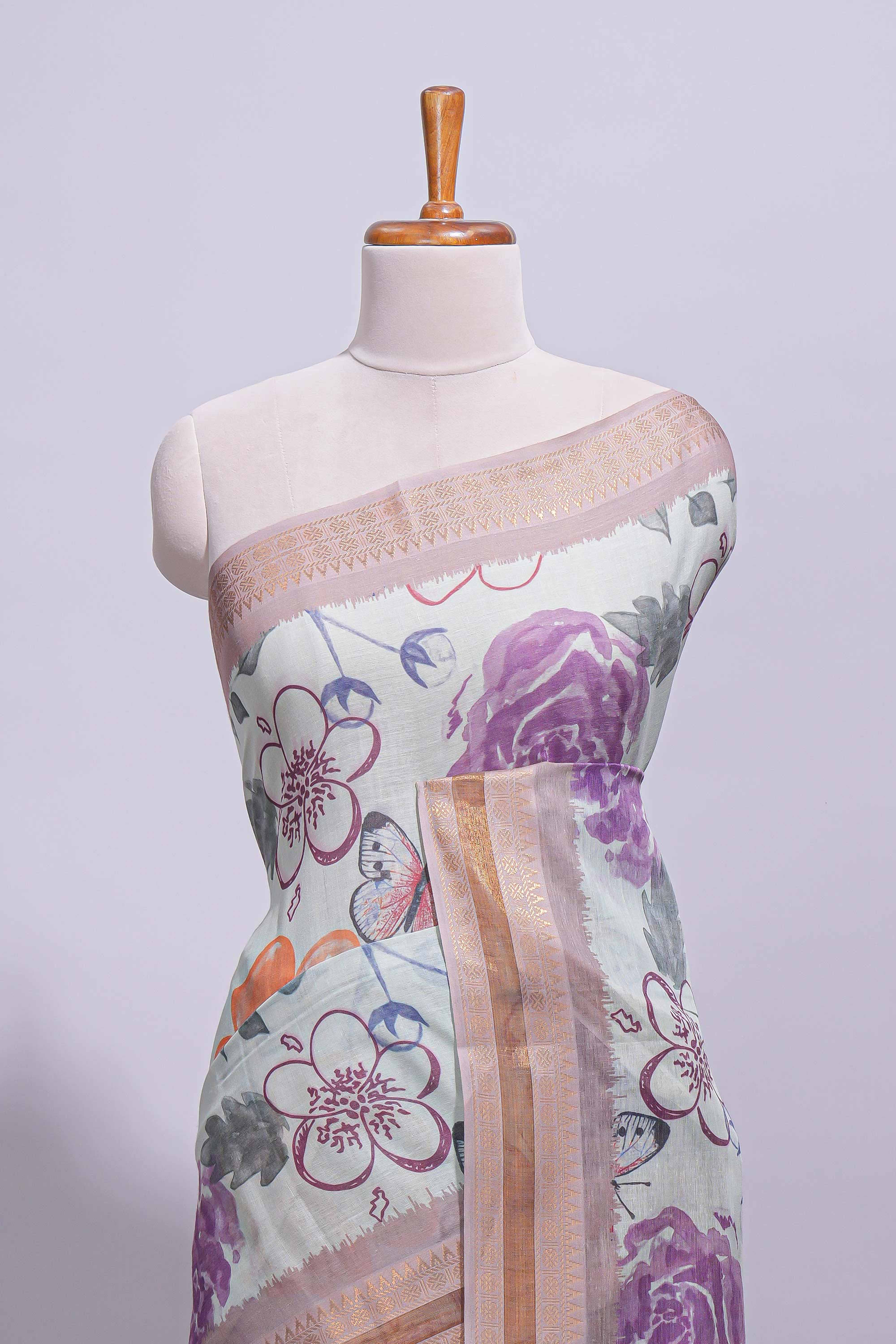 Ivory colour linen saree floral prints with pastel accents by a subtle gold zari border and printed pallu with tassel along with printed blouse - Image 3