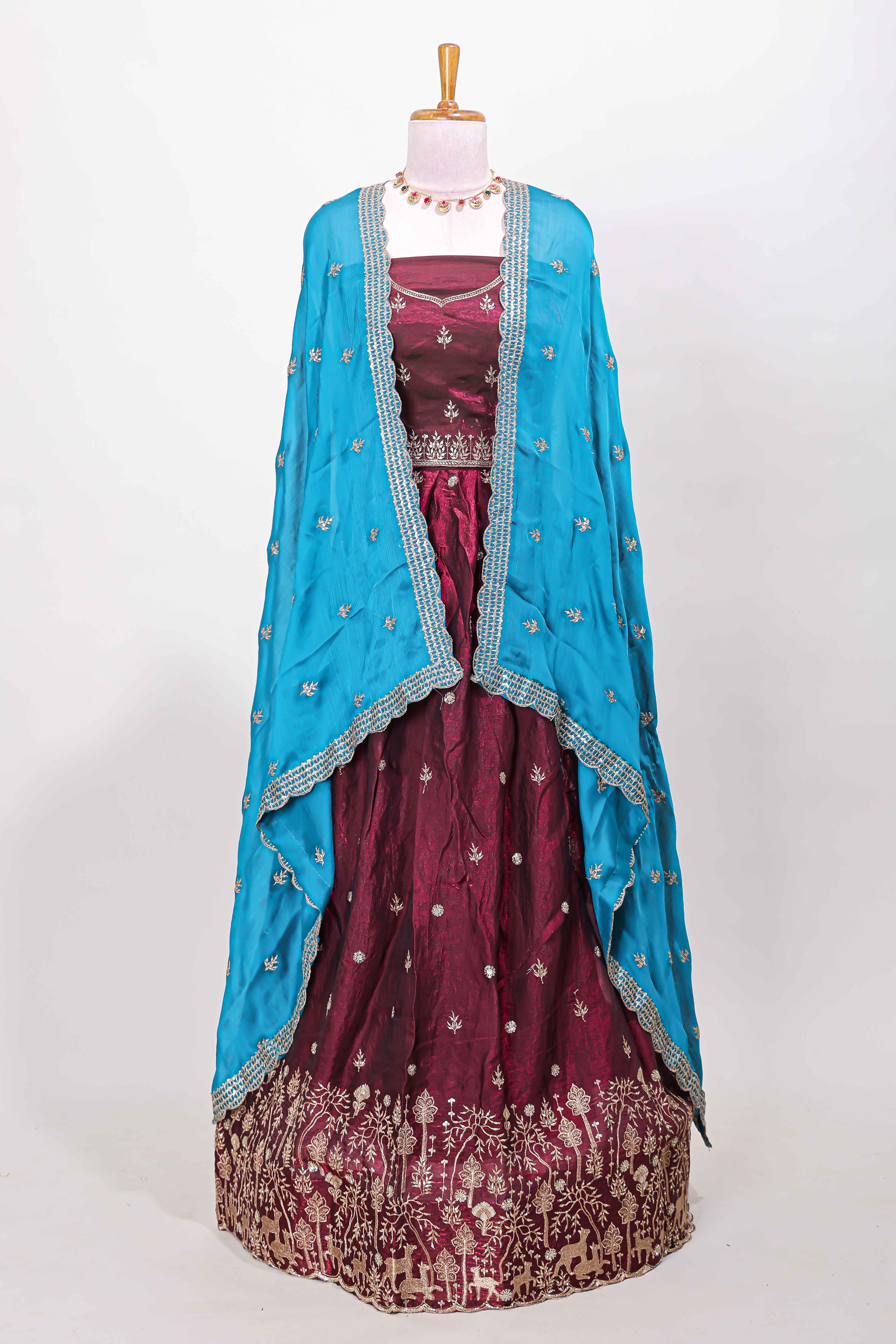 Maroon fendy chiffon lehenga with all over embroidery and stone work, paired with a contrast dhavani - Image 2