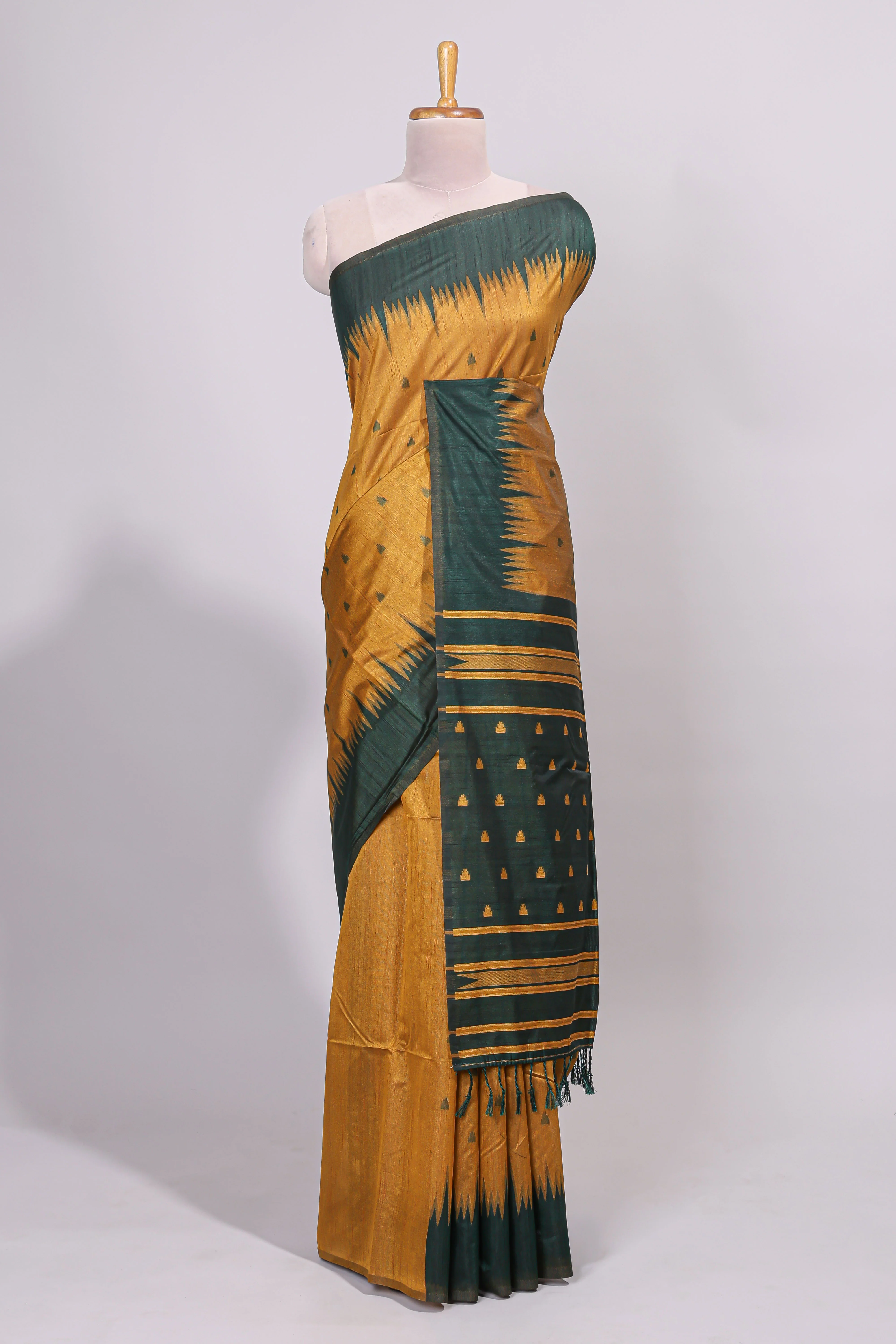 Mustard ikkat motifs design semi tussar saree with contrast green border and striped blouse - Image 2