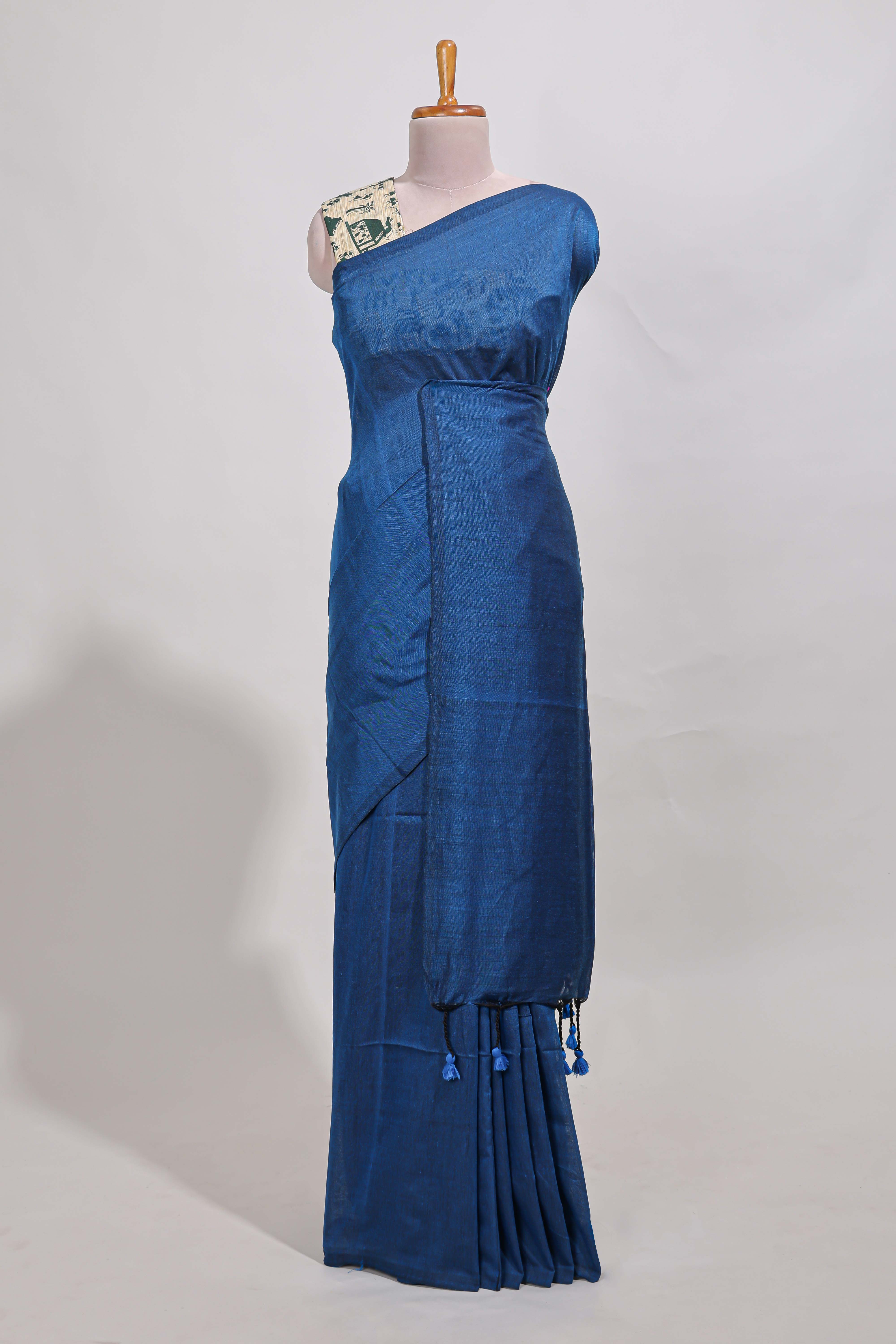Navy blue plain south cotton sarees with contrast peacock green warli printed blouse