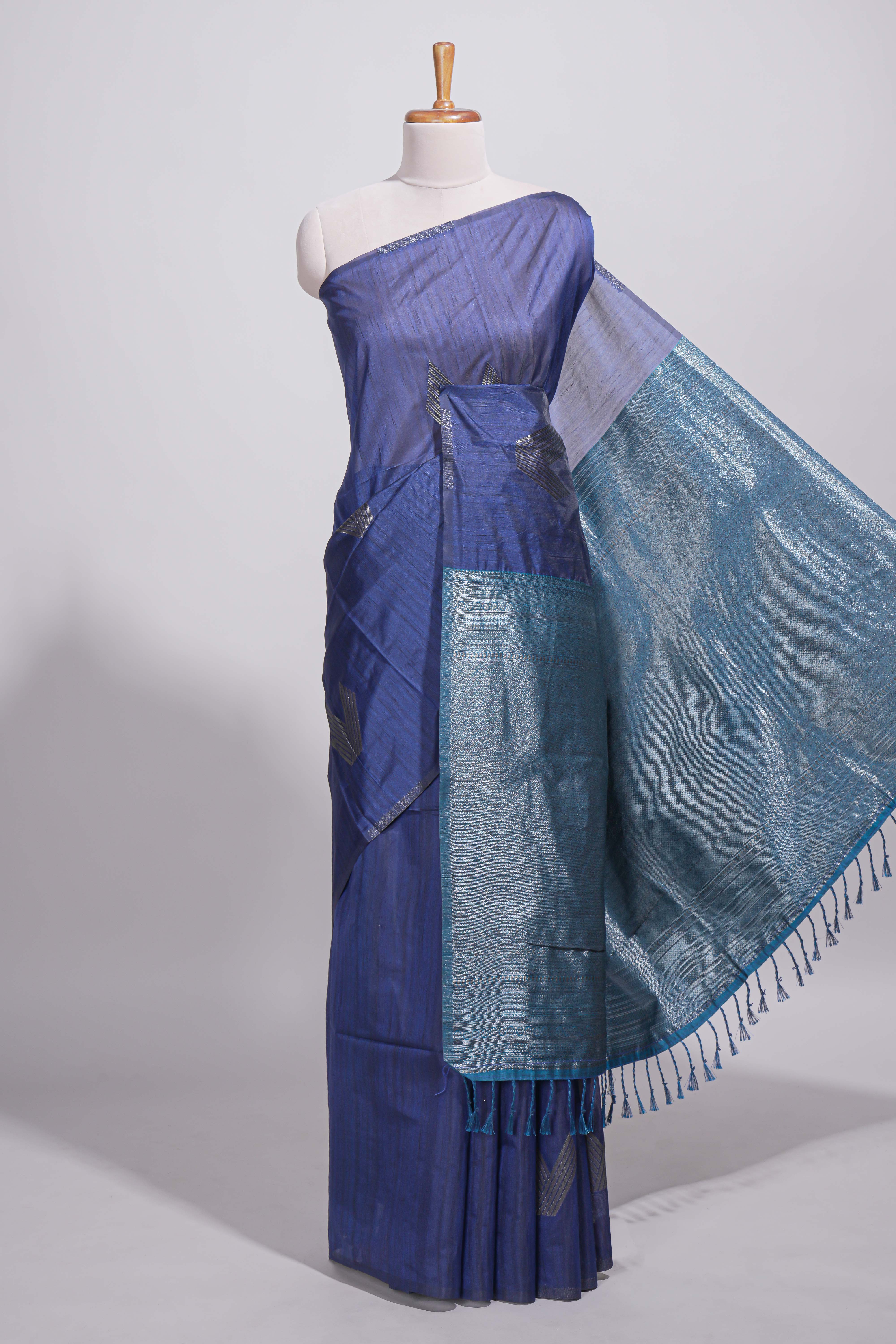 Navy blue tussar saree with subtle silver woven motifs paired with a rich zari pallu with tassels with contrast blouse piece - Image 2