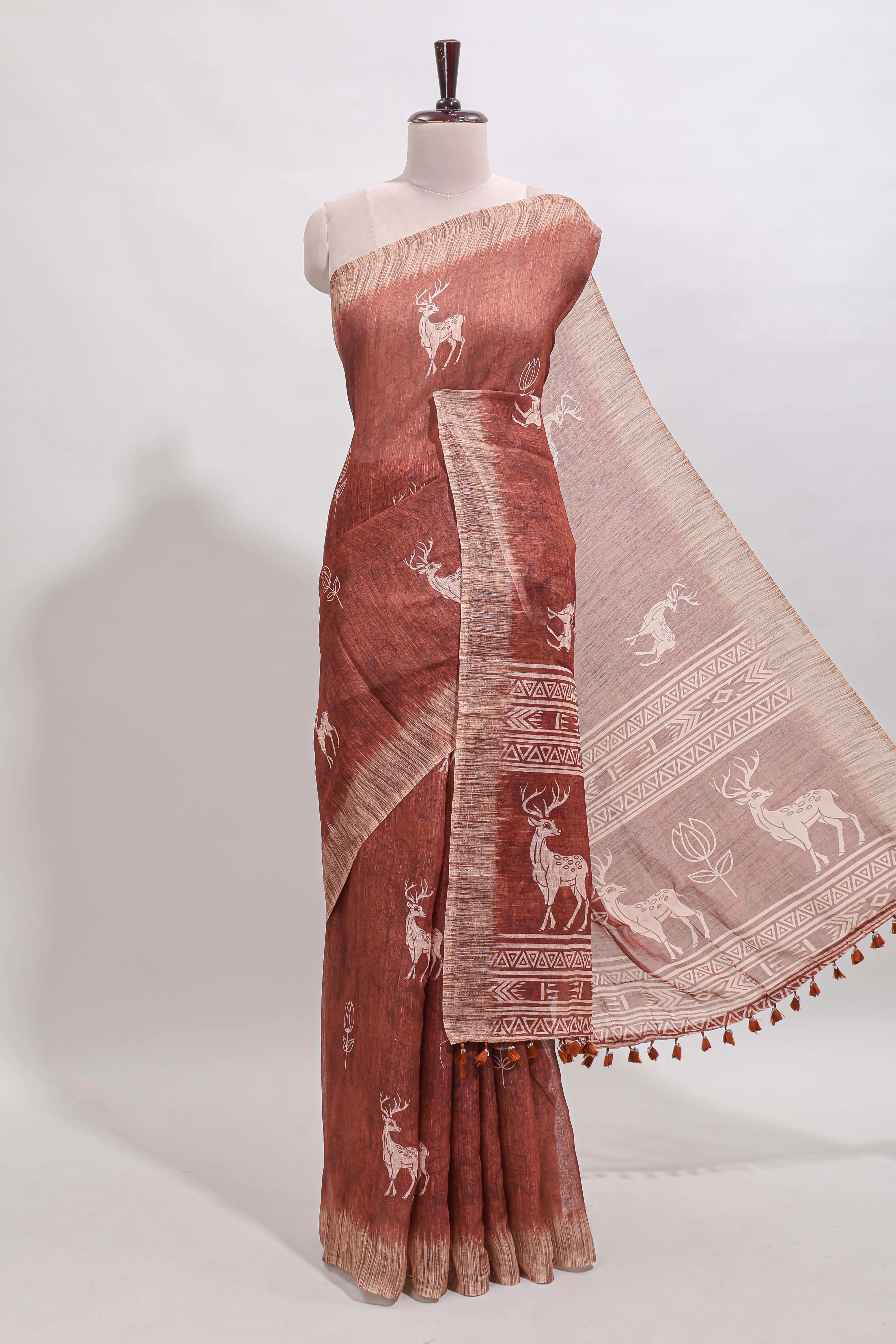 Orange floral & deer design motifs linen cotton saree with contrast border and matching printed blouse