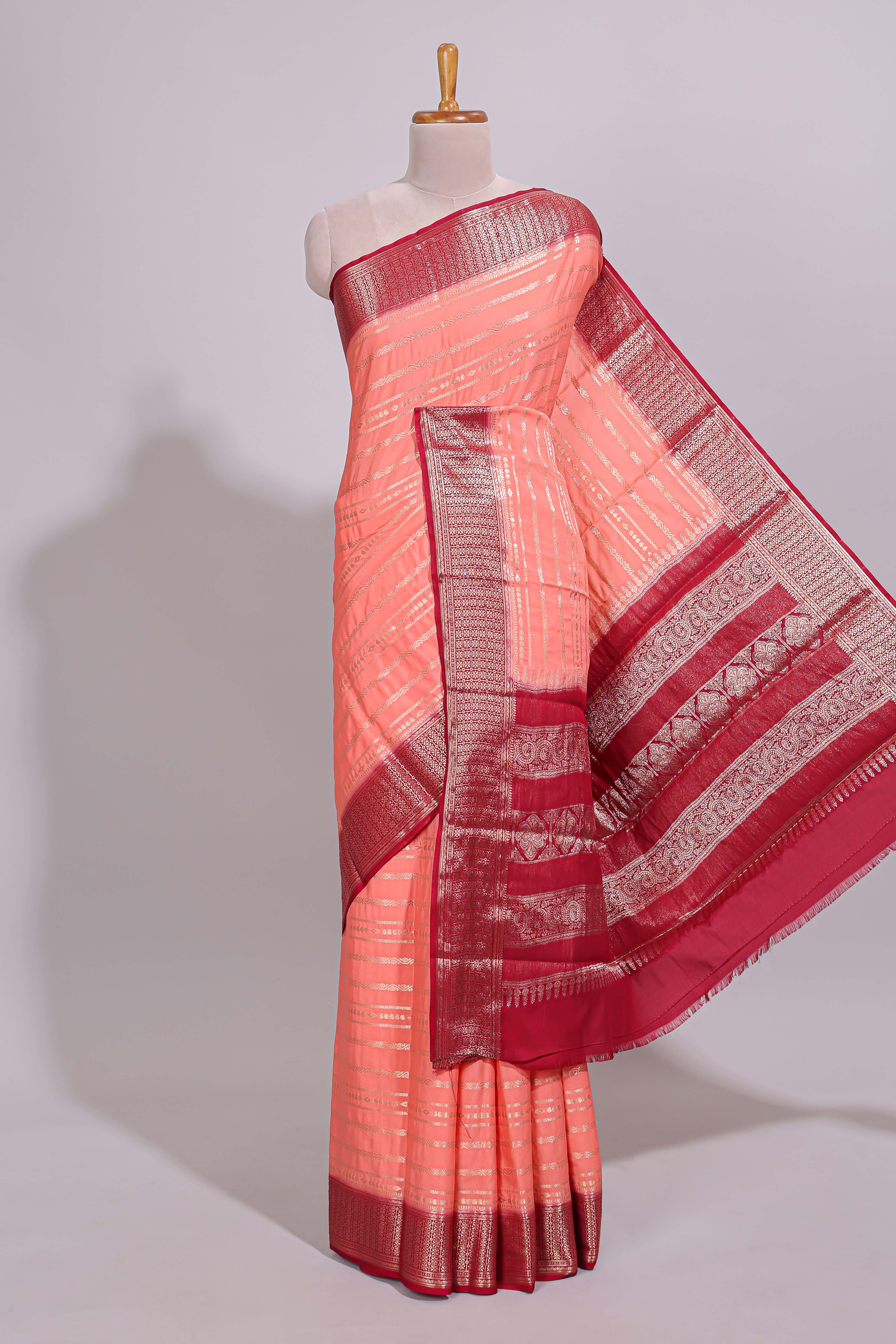 Peach zari striped dola silk saree with contrast zari border and striped pallu