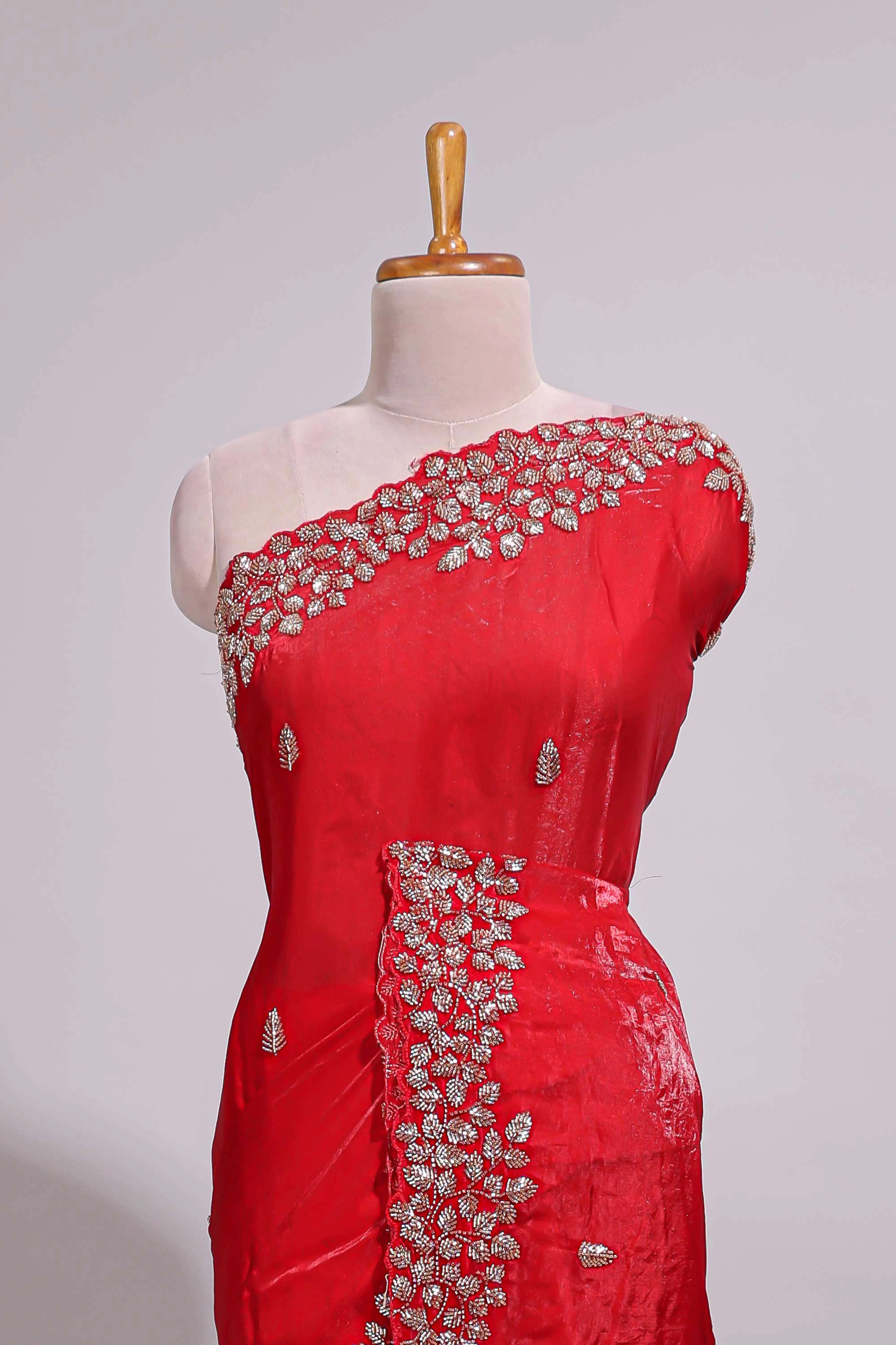 Bright red saree with elegant golden floral embroidery and a rich embellished border along with matching blouse - Image 3