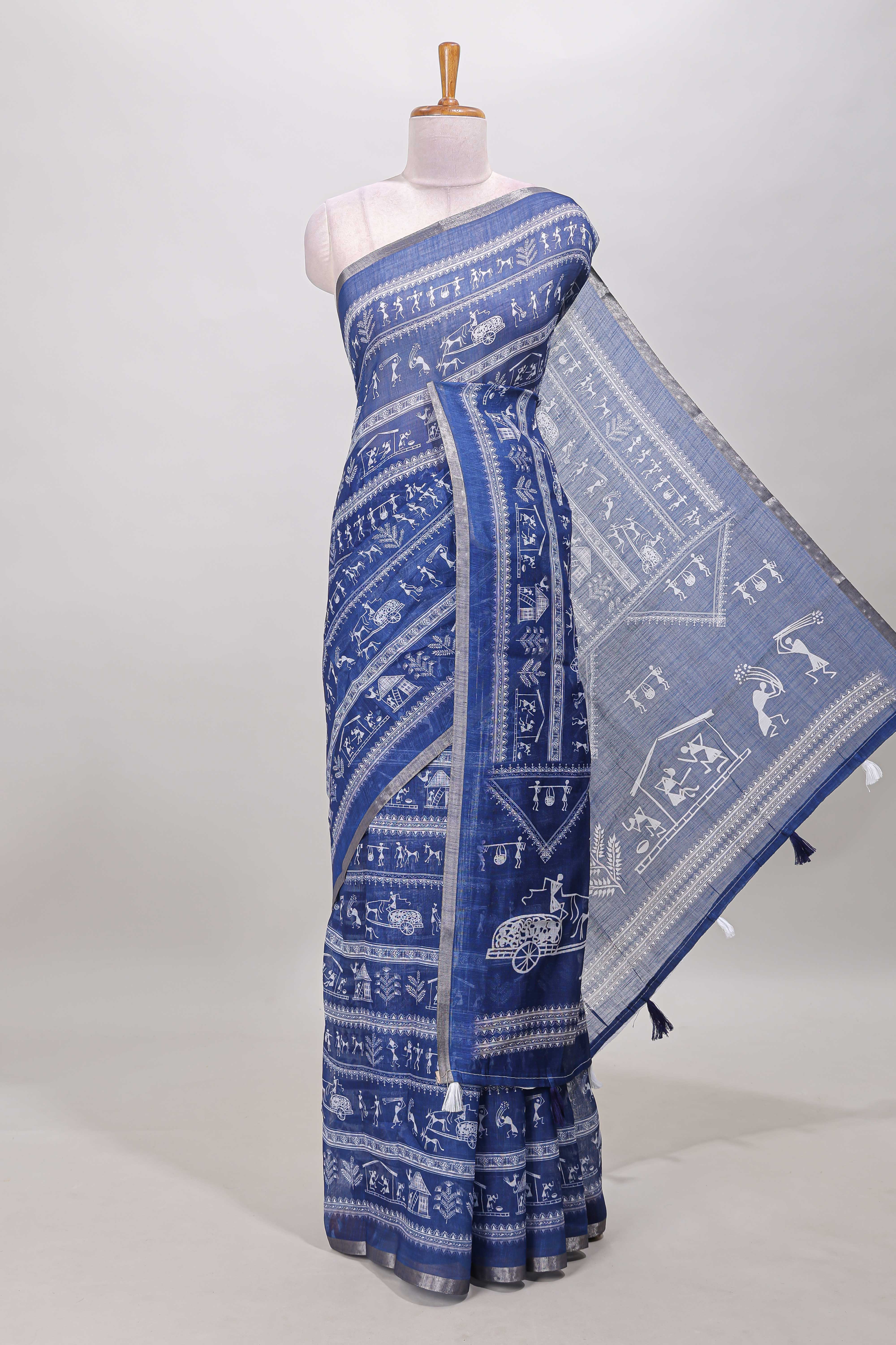 Royal blue warli print linen cotton saree with self zari border and printed blouse