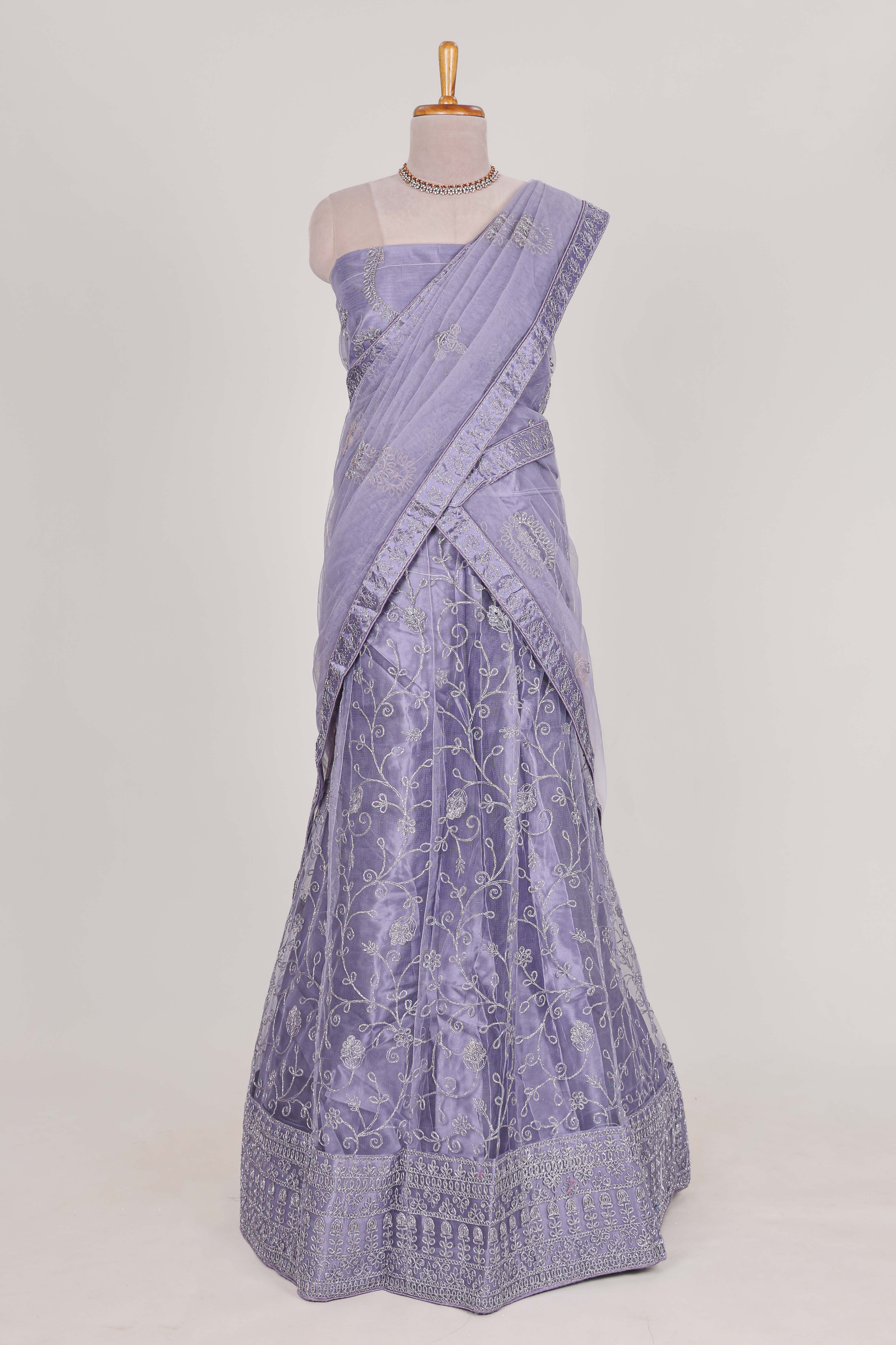 Lavender net lehenga with embroidery work and Paired with a matching net shawl