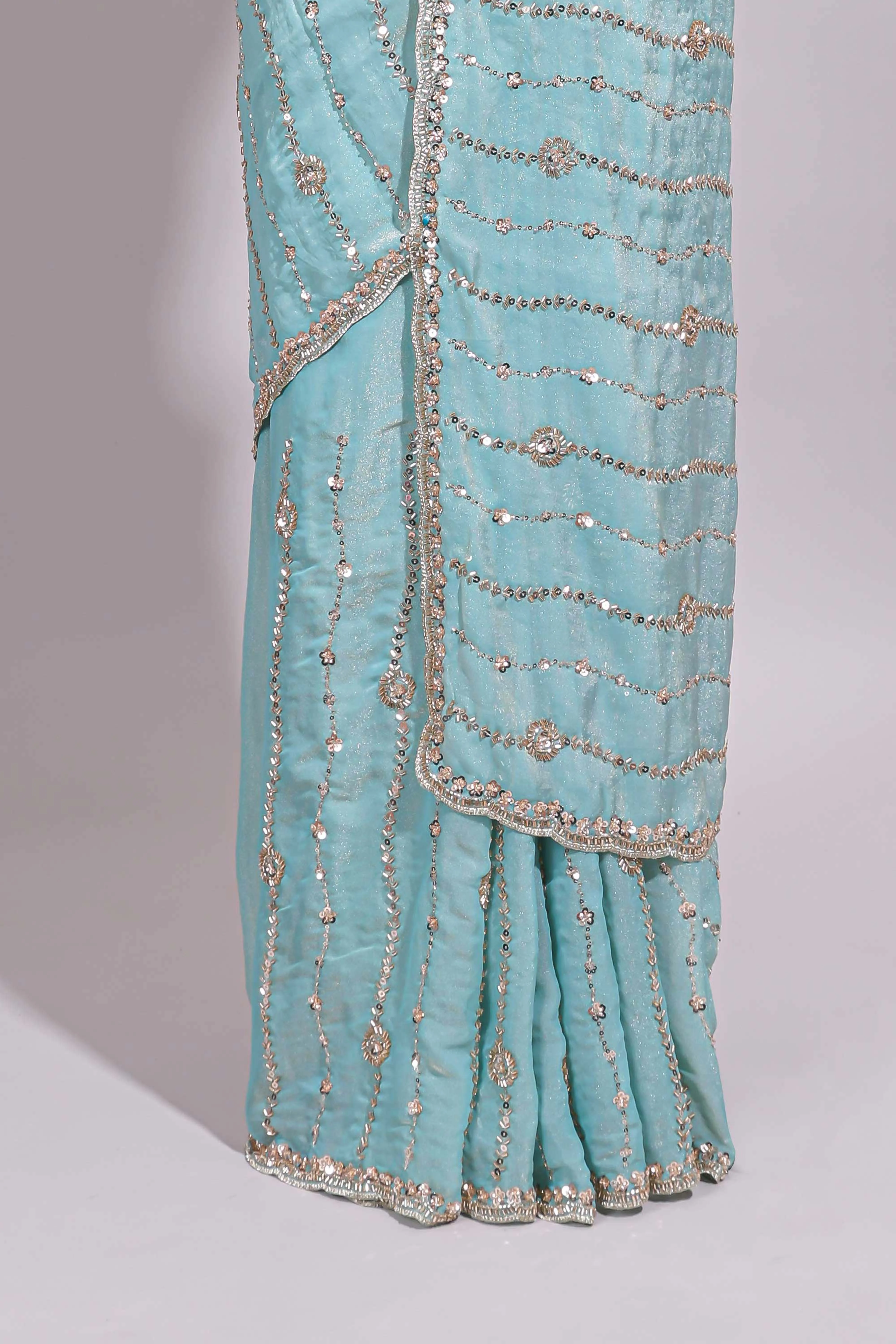 Pastel blue saree with silver sequin wavy line embroidery floral motifs and a sparkling embellished border along with matching blouse - Image 4