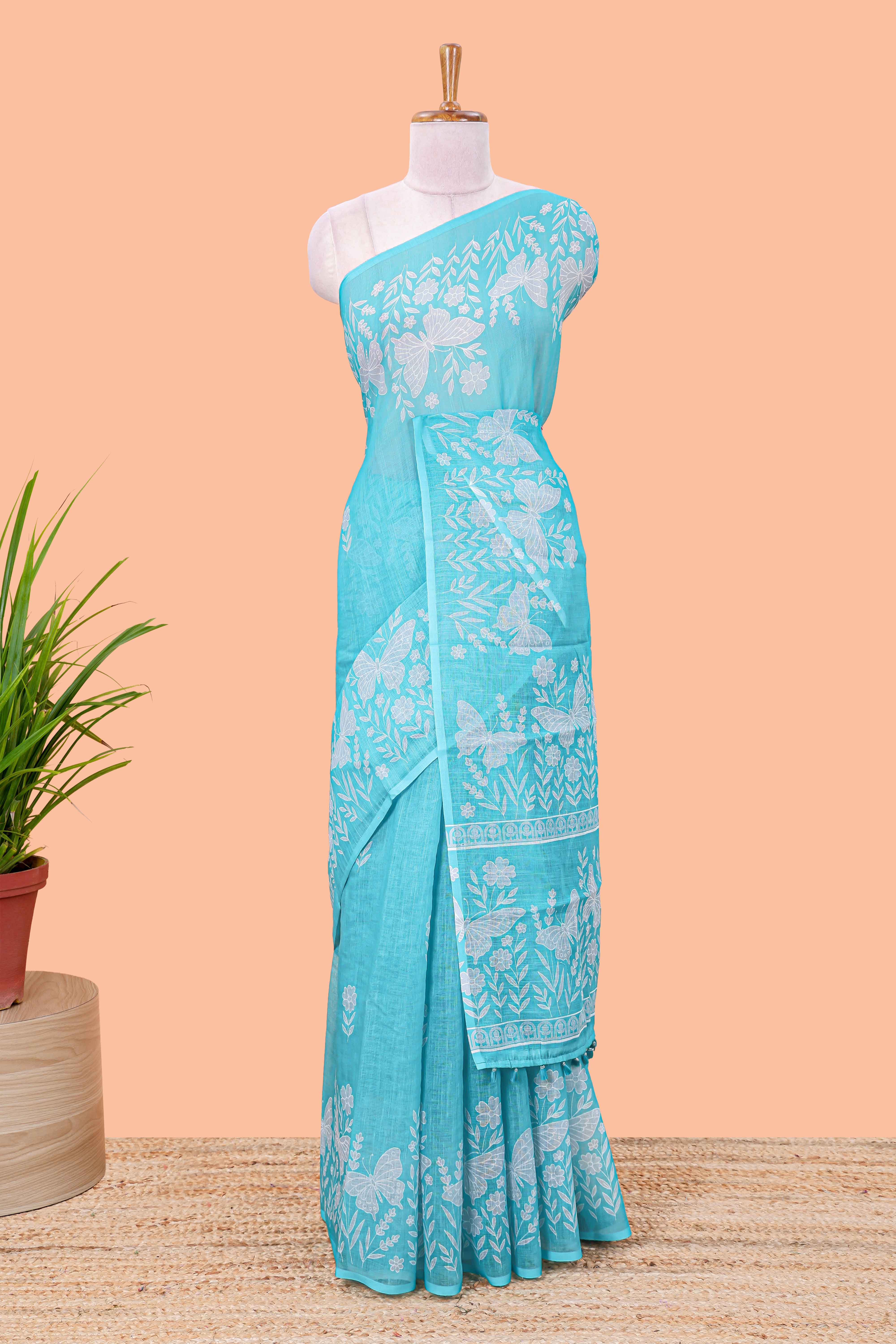 Turquoise green linen cotton saree with floral buttas and butterfly motifs border, Printed self pallu and blouse - Image 2