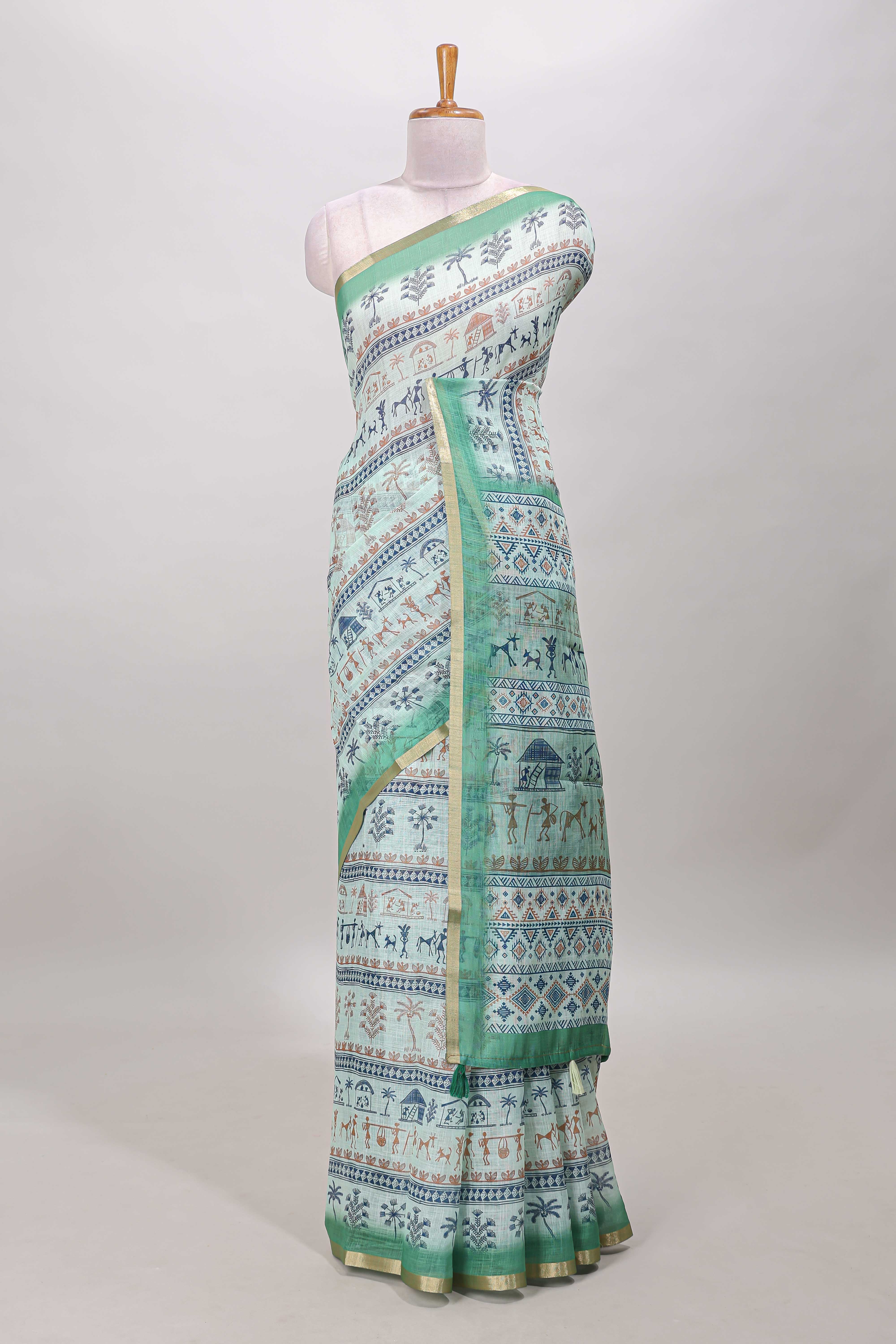 Turquoise green warli print linen cotton saree with self zari border and printed blouse - Image 2