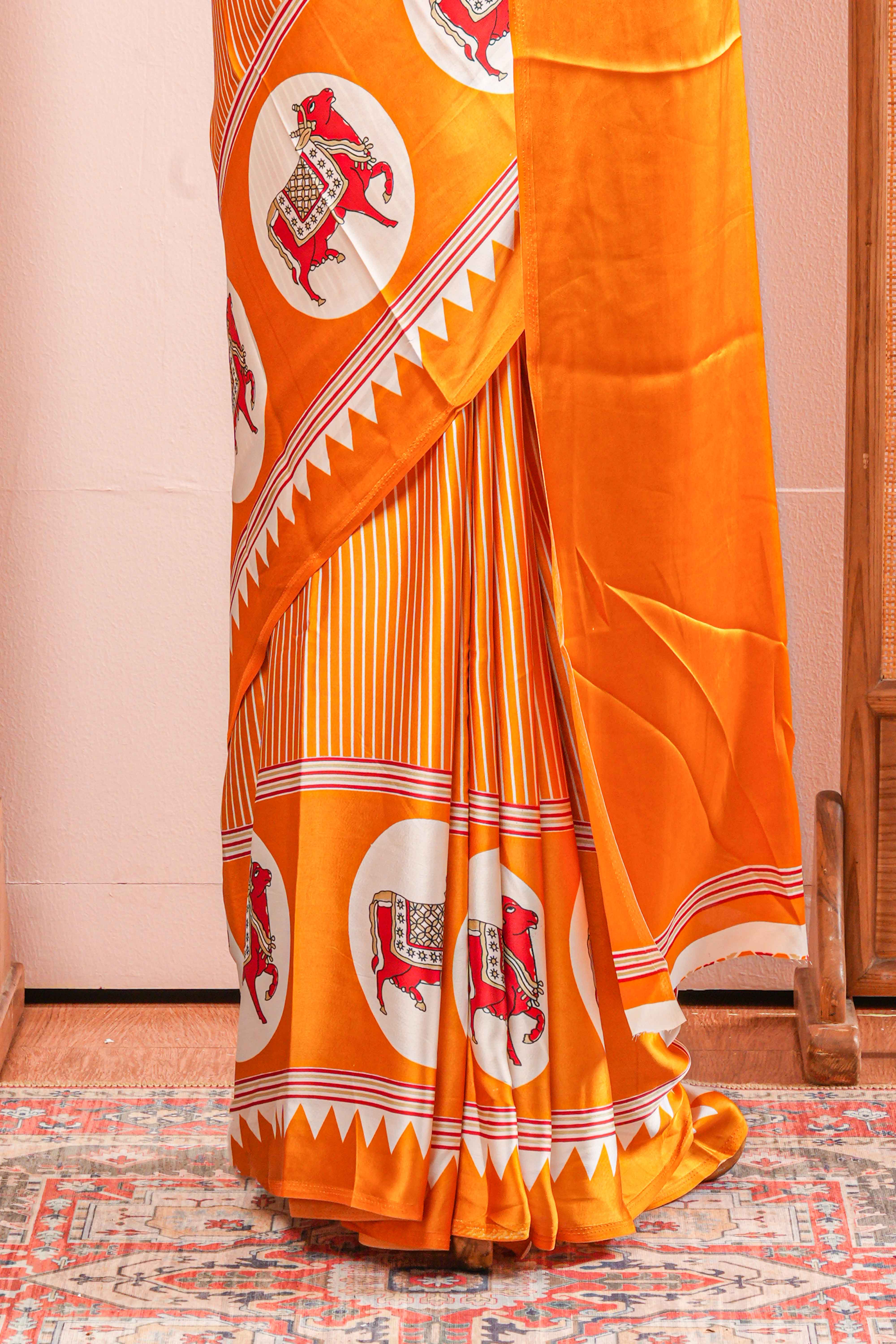 Vibrant Yellow Modal Silk Saree The Body Has Fine Vertical White Stripes The Border Are Highlighted Pichwai Design Along With Ajrakh Printed Blouse - Image 4