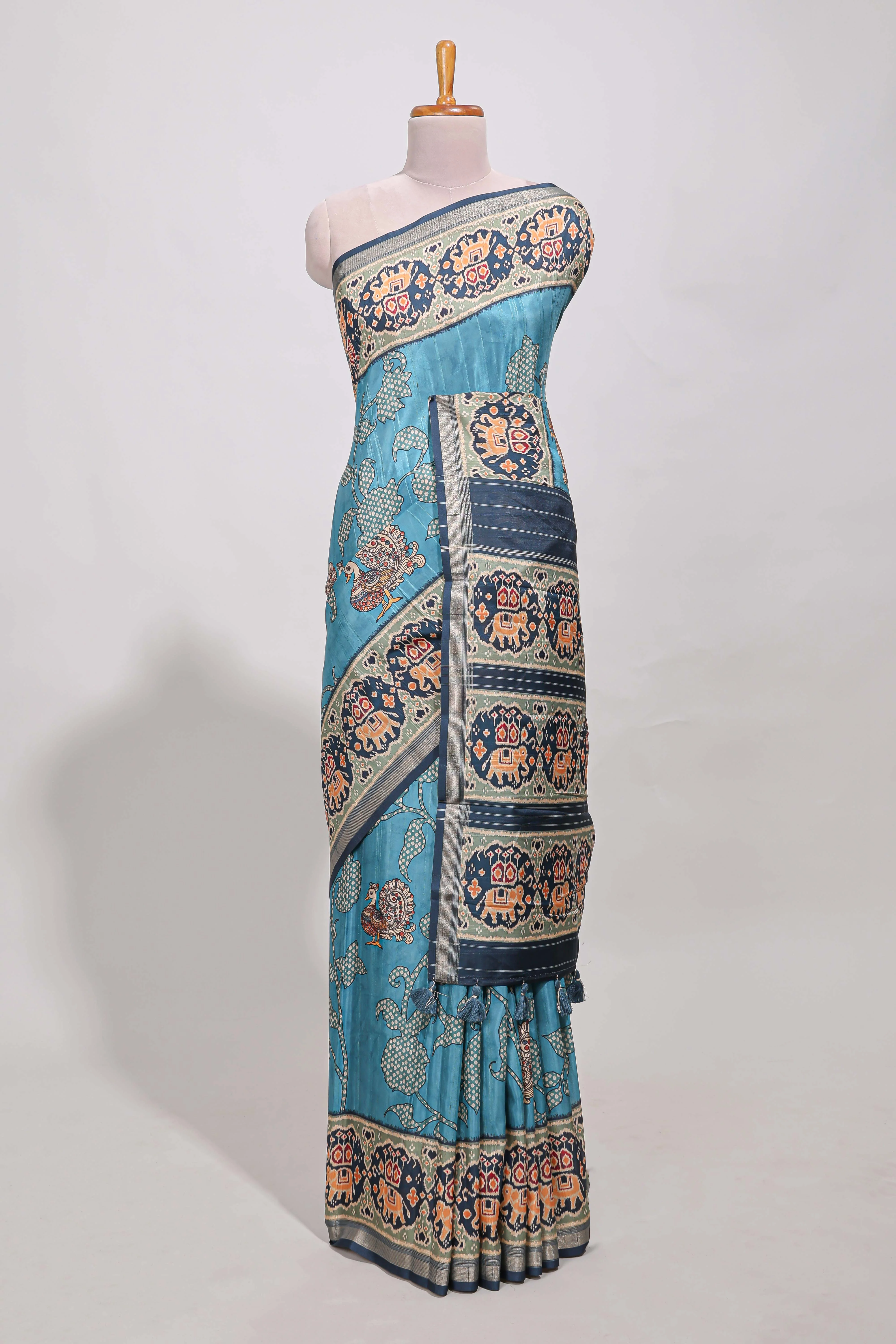 Blue patola  tussar saree pichwai art and peacock motifs elephant designs with rich matching pallu along with tussels