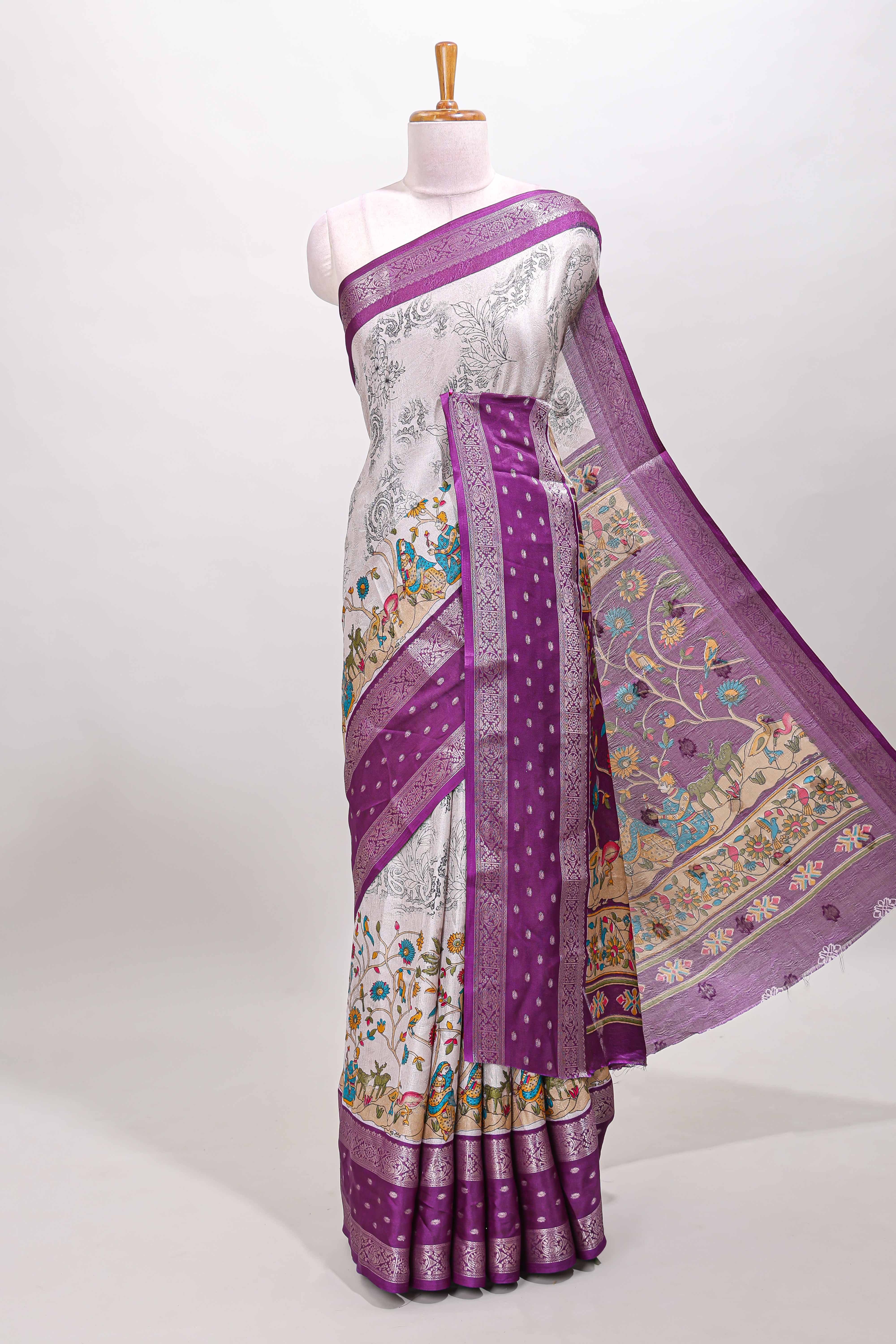 White traditional kalamkari themed marsh georgette saree with contrast violet bentex zari border and pallu